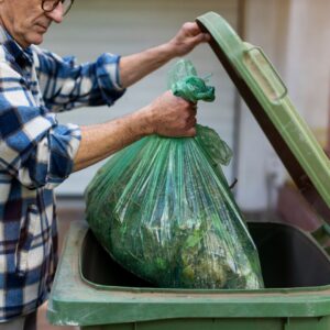 man taking out his garbage