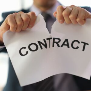 A business owner ripping up a contract