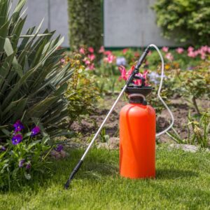 a container of mosquito killer on a lawn